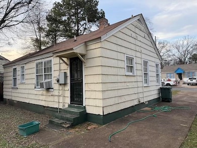 View of home's exterior with cooling unit
