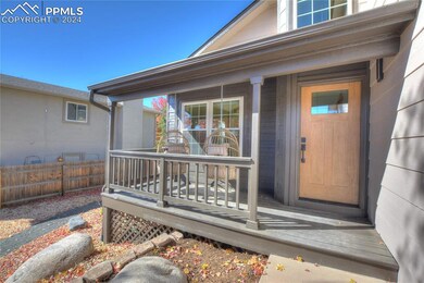View of exterior entry featuring covered porch