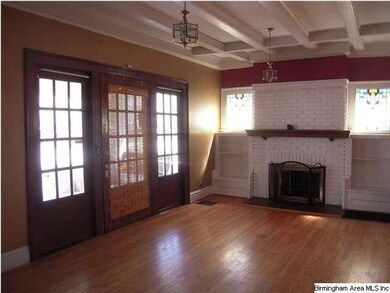 Spacious Living Room with Fireplace and Coffered C
