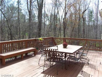 Patio/Deck - A large deck perfect for entertaining overlooks the wooded backyard...