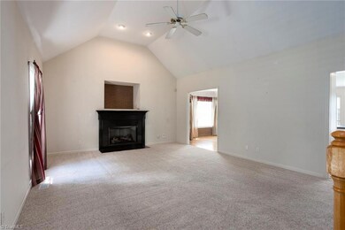 Additional view of living room. Non-vented gas logs have remote.