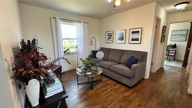 Living room featuring dark hardwood / wood-style f