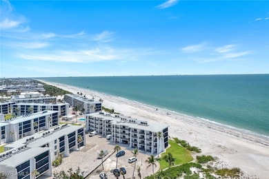 Aerial view of extended coastline and apartment co