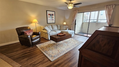 Living area peers upon a spacious enclosed patio.
