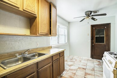 The kitchen offers space for a breakfast area.