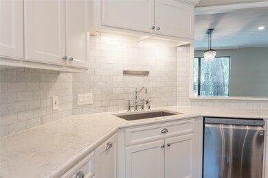 Notice the chic subway tile backsplash with beauti