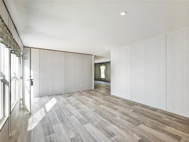 Empty room featuring light wood finished floors, a