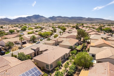 Aerial view of residential area featuring mountain