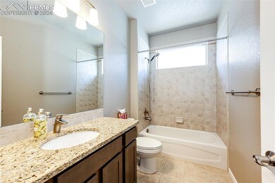 Full bathroom featuring tile patterned floors, toi