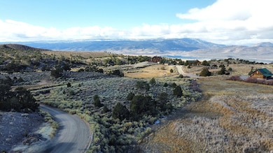 View of mountain backdrop featuring a large body of water