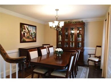 The formal dining room welcomes your guests on tho
