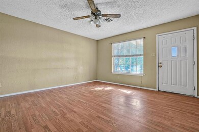 Foyer featuring ceiling fan, hardwood / wood-style