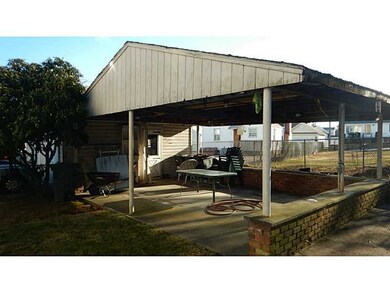 Exterior Back. Covered patio and fenced yard
