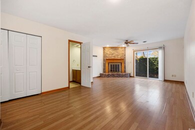 Unfurnished living room with light wood-style floo