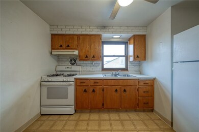 Kitchen with gas stove and refrigerator