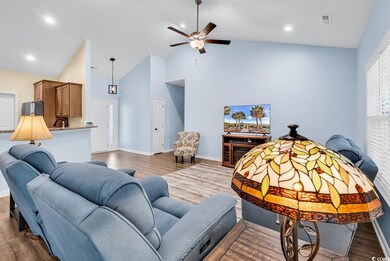 Living area with wood finished floors, baseboards,