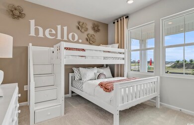 Bedroom with baseboards and carpet