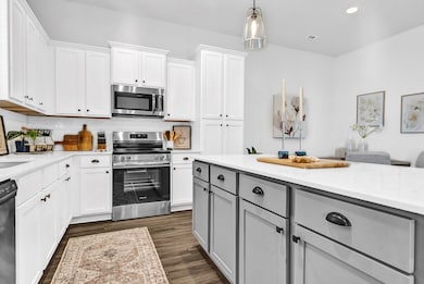 CHEFS KITCHEN! FLOATING ISLAND WITH PLENTY OF COUNTER SPACE AND CABNETS/STORAGE/ PANTRY! ALSO INCLUDES STAINLESS STEEL APPLIANCES!