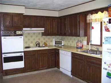 Kitchen. The kitchen has updated ceramic tile floo