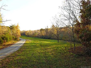 Pasture.  Drive on left and creek in wood line on 