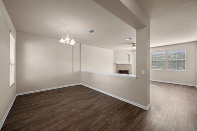 Unfurnished room with dark wood-style floors, bas