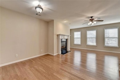 Unfurnished living room with a fireplace with flus
