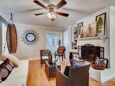 Living Room w/ Wood Burning Fireplace