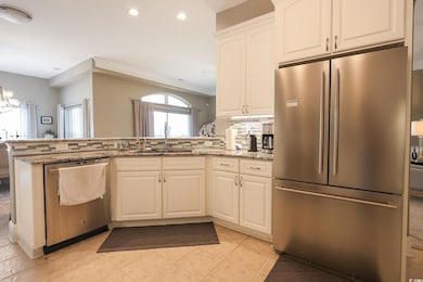 Kitchen with a sink, stainless steel appliances, a