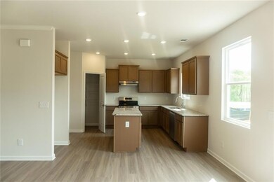 Kitchen featuring visible vents, a center island, 