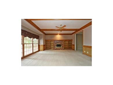 Large Family Room overlooks treed back yard.