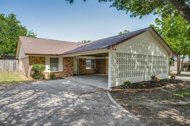View of front facade with a carport