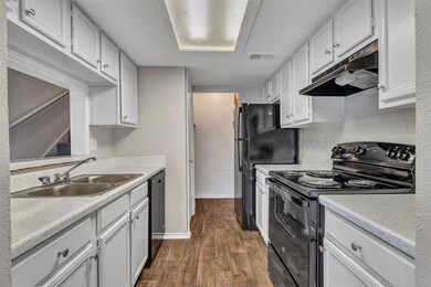 Kitchen w/ black appliances