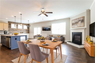 Dining space with ceiling fan, dark hardwood / woo