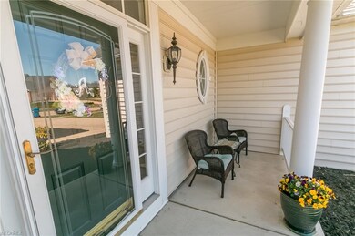 The charming front porch is the ideal spot for wat