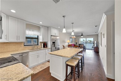 Kitchen with stainless steel appliances, a sink, c