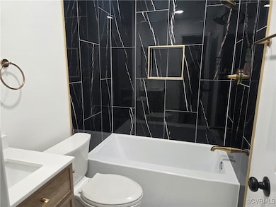 Full bath with shower / tub combination and vanity