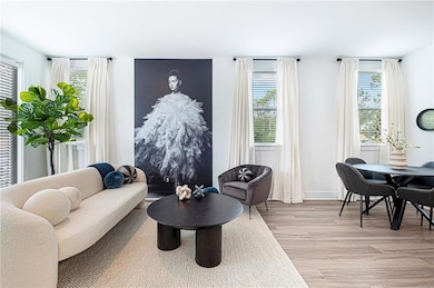 Living area featuring light hardwood / wood-style 