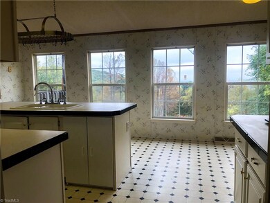 Gorgeous view from the kitchen overlooking the front yard and pasture.