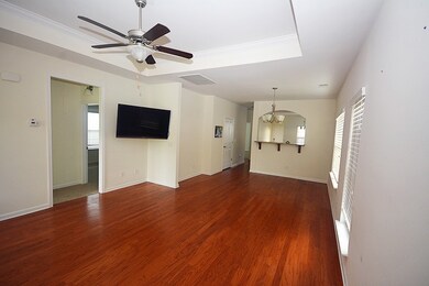 Another view of the living room and dining room. The TV stays with the house.