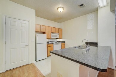 Kitchen featuring light wood-type flooring, kitche