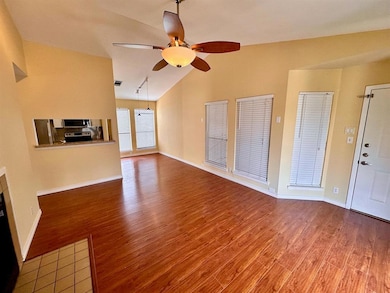 Unfurnished living room featuring wood finished f