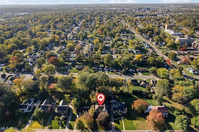 View of property location with nearby suburban area