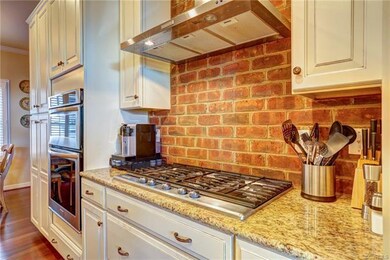 Gas cooktop with stainless steel hood, wall-oven, 