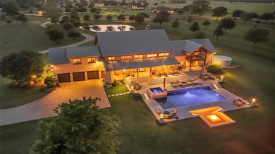 Outdoor pool featuring a fire pit, a yard, an in-