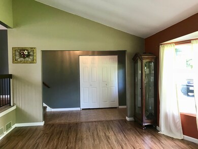 Living rm & large closet in ceramic tiled foyer