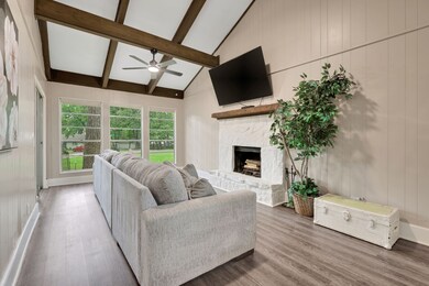 Cozy up in the living room beneath beautiful wood