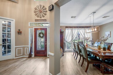 Welcoming entry features tall ceilings and leads to the dining room, office, and secondary bedroom & bathroom.