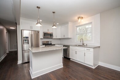 high quality new kitchen with stainless appliances and granite