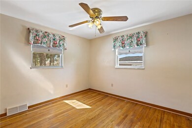 Master bedroom with hardwood flooring