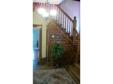 Entry/Foyer. Beautiful woodwork on staircase.